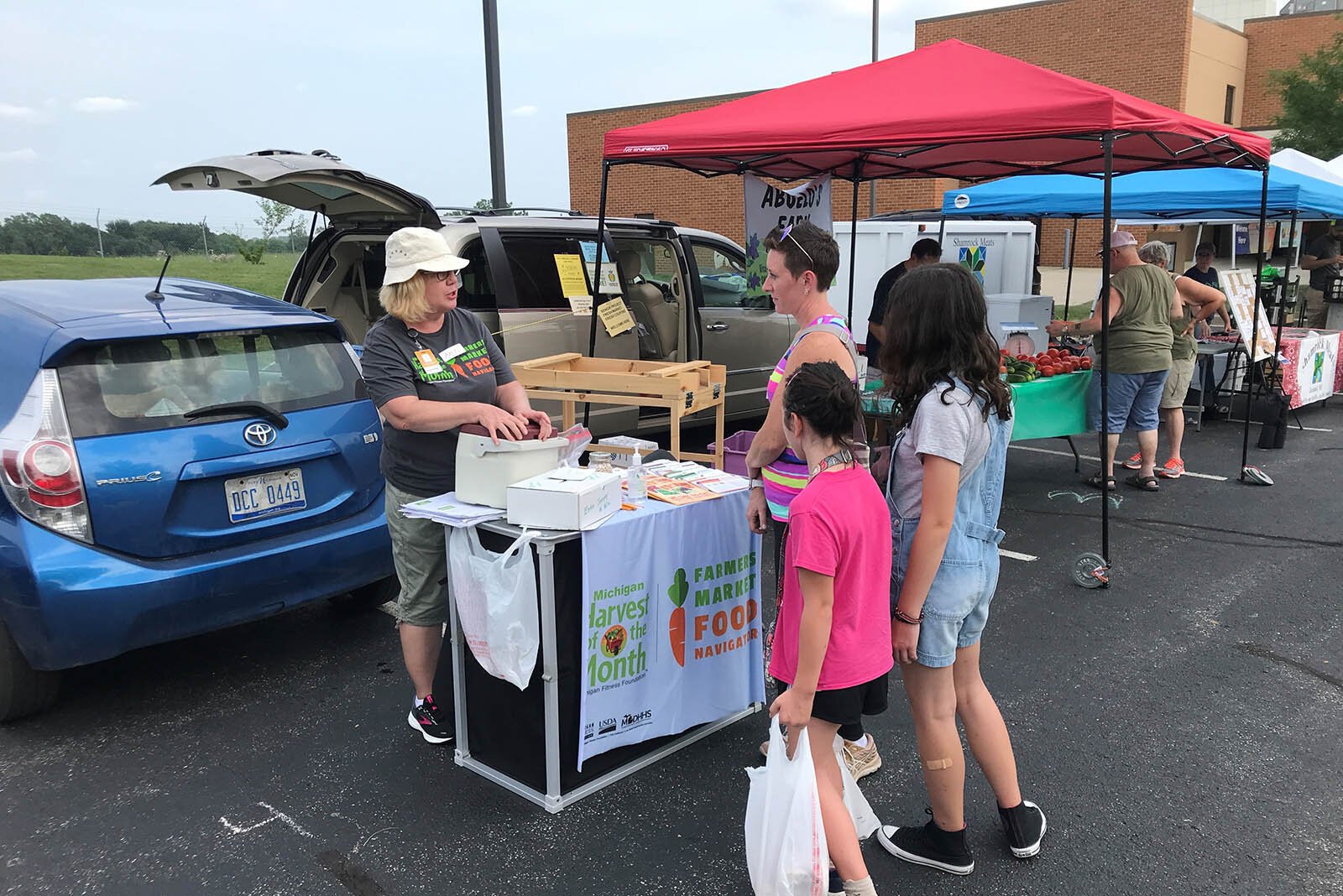 KISD Nutrition Educator Amy Klinkoski at the Kentwood Farmers Market at the Kent District Library's Kentwood branch.