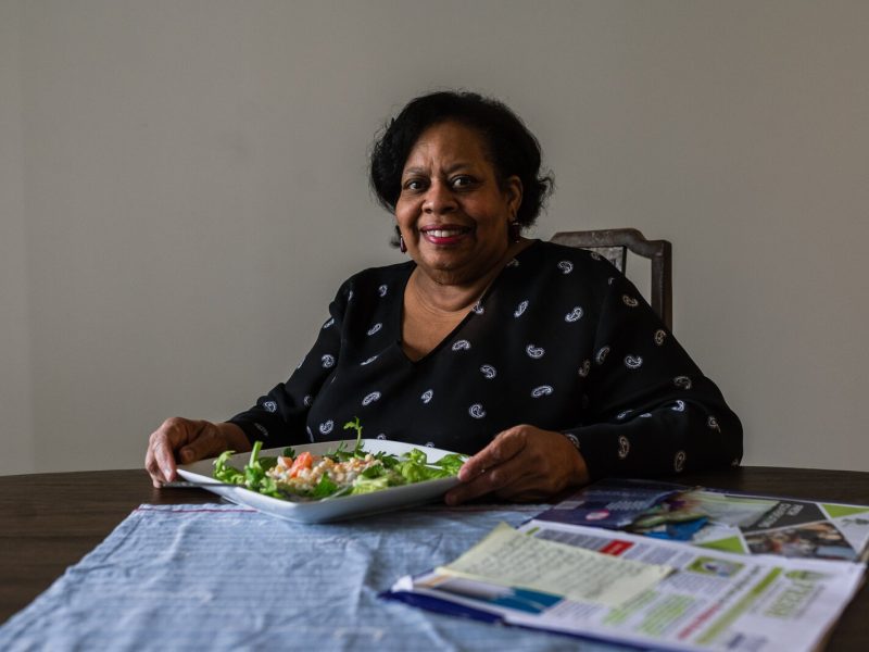 Fresh Conversations participant LaDonna Johnson prepares to eat a corn salad she made using a recipe she got from the program.