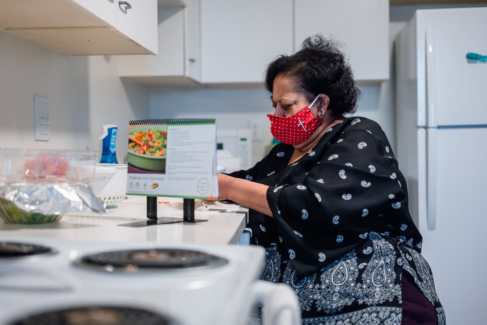 Fresh Conversations participant LaDonna Johnson makes corn salad using a recipe she got from the program.