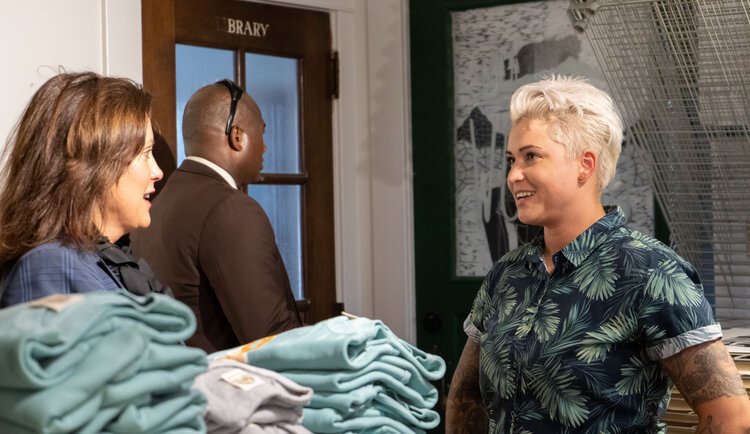 Governor Whitmer and Erica Lang inside Woosah Outfitters. 