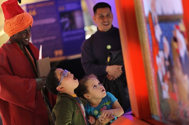 Kids in awe at a display in "1001 Inventions"