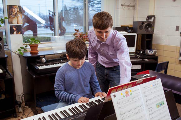 PIANO LABS INSTRUCTOR HUGH LITTLE WITH WOODS LAKE ELEMENTARY SCHOOL STUDENT