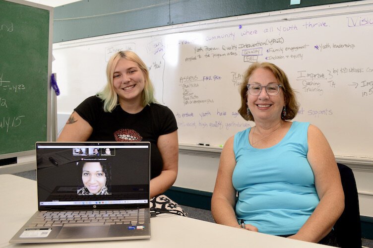 At a Kalamazoo Youth Development Network meeting at Lincoln Elementary. OST program development coach Bailey Crist, executive director Meg Blinkiewicz (in person), OST coaches Justin Brownlee and Abra Steppes (online).
