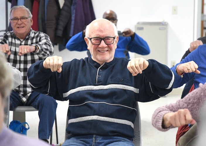 Hugh Gauss works out during a Senior Health Partners exercise class at the Trinity Neighborhood Center.