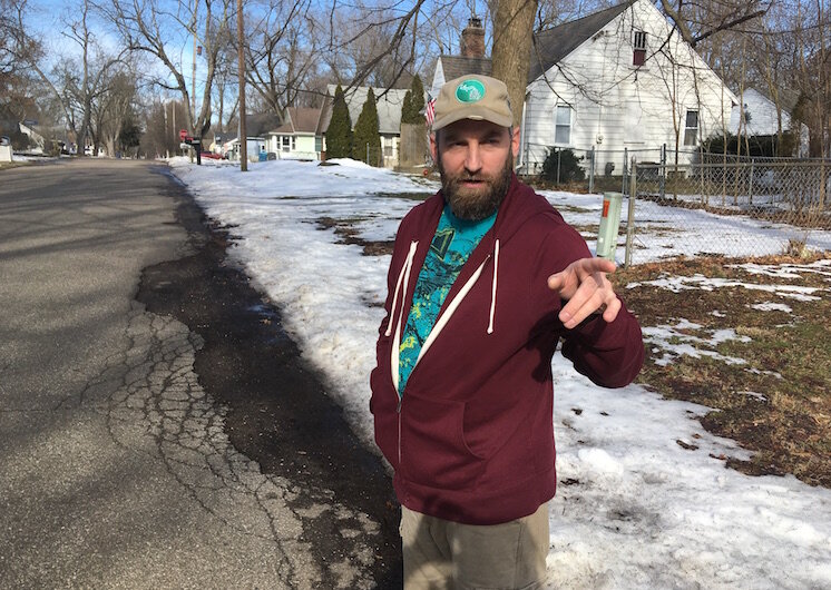 Andrew Richmond points out some of some of the exterior fix-it work that helped him get to know some of his neighbors in the 3800 block of Madison Avenue.