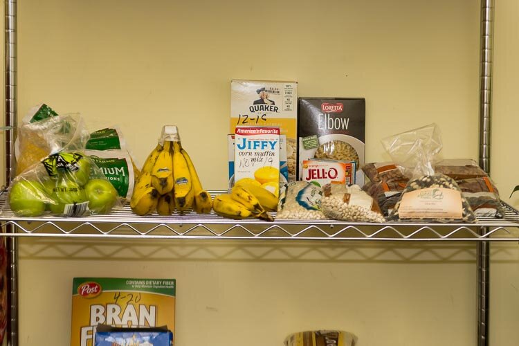 With support from D&W grocery store, neighbors keep a food pantry stocked at the Oakwood Community Center.