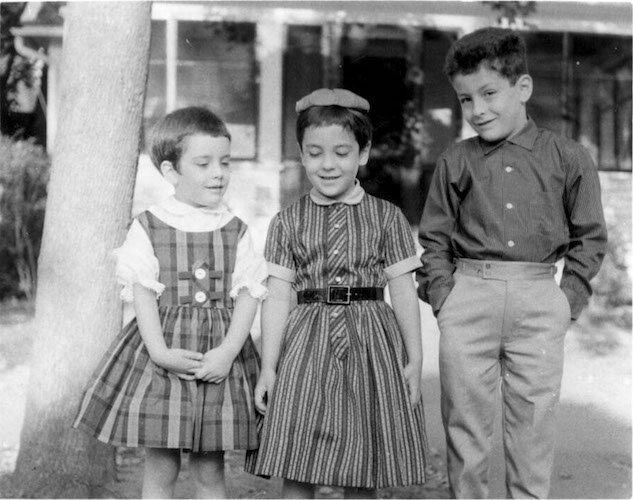Laura, Sharon and Lance Jr. Ferraro pose near the family's popular Oak Street porch.