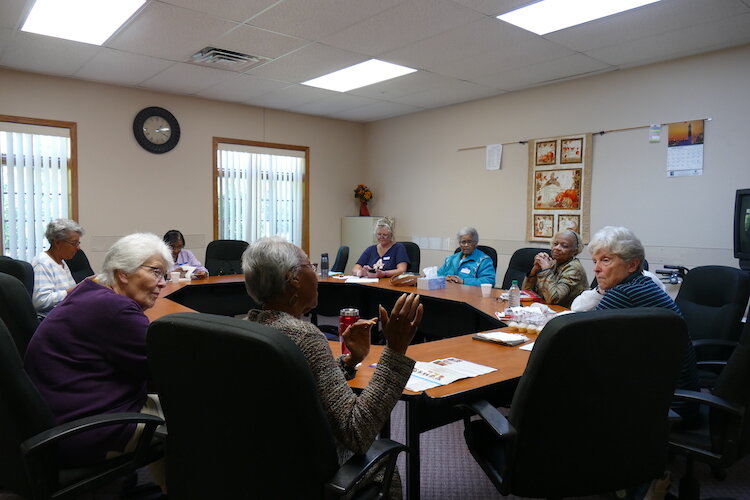 Dorothy McClendon has the group's attention at a recent meeting of the Sacred Conversations Book Group.