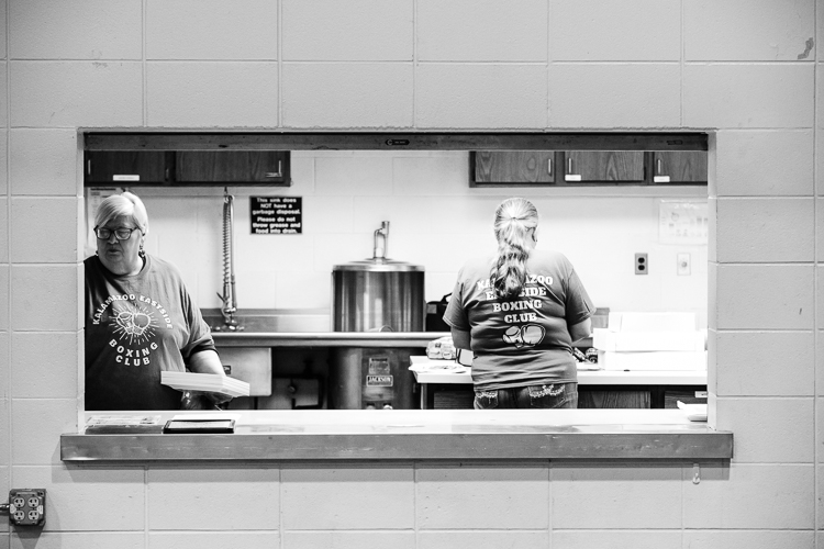 Former Eastside Boxing Coach Kay Mero, a Kalamazoo social worker, (left) now helps organize the boxing shows and runs the concession stand.