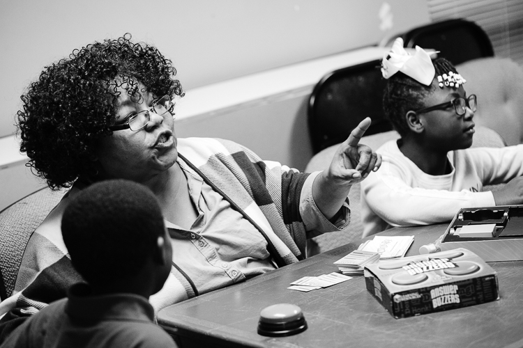 Heather Taylor, Assistant Lead Teacher, is always up for a good game with CHAMPS youth. Photo by Eric Hennig