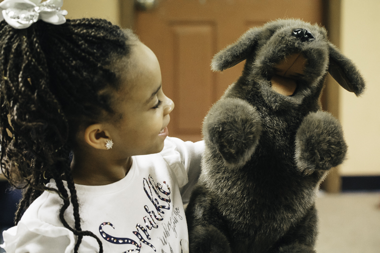Who doesn't love a good puppet show? "Entertain me," says Yulonda Taylor, Lead Development Teacher. Photo by Eric Hennig