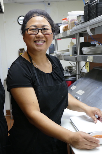 Jennifer Cole finishes up an order during the lunch rush.