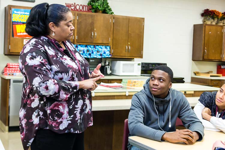 Lisa Boulding works with young people in a leadership program at Kalamazoo Central High School
