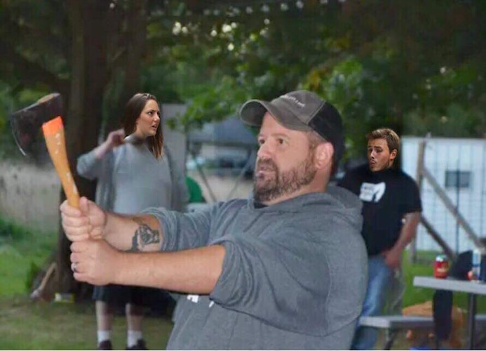 Jeremy Andrews with an axe used in axe throwing competition.