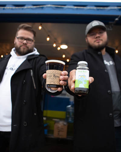 Tristan and Justin Tristan Bredehoft show off their drinks.