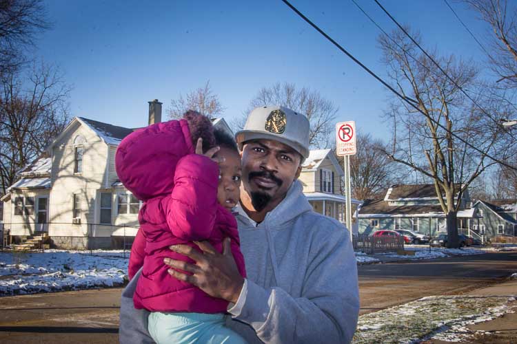 Ernest Gathing Jr. says a Kalamazoo Public Safety Officer told him to move if he did not like the No Parking, Stopping, Standing sign in front of his house. Photo by Susan Andress