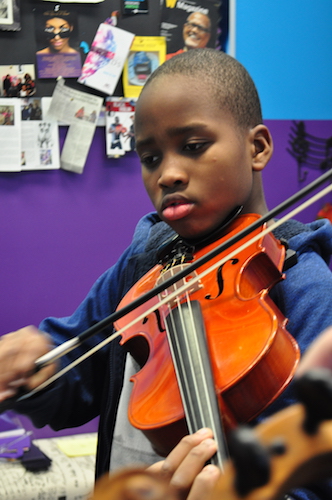 Tomiwa, a 5th grade Kalamazoo Public School student, has been taking viola for two years at the Fox Gospel Music Center.