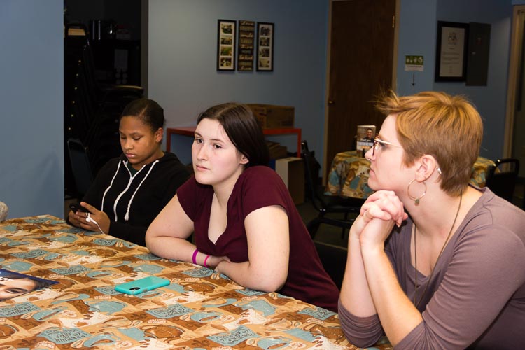 From left, Denika Dunning-Calling All Youth Member, Kori Sonnevil-Calling All Youth Member, Laceey Ruble-Youth Involvement Coordinator prepare for an upcoming forum with state legislators.
