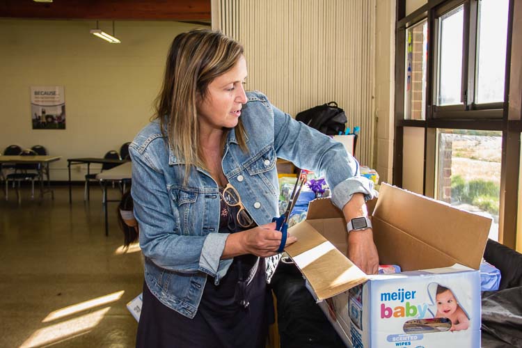 Kathy Szenda Wilson, executive director of BC Pulse, helps at a recent diaper distribution. Photo by Susan Andress 