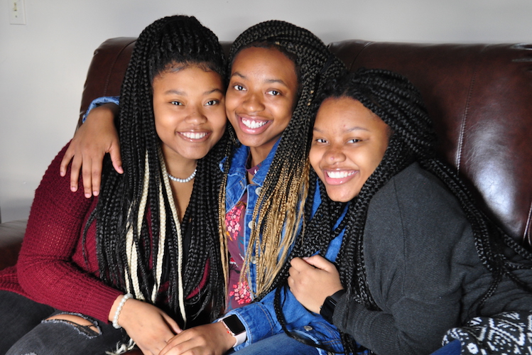 Ke'Aujanaa, Ke'Asia, and Ken'Aujune Shepherd-Friday together at home. Caring for Ke'Aujanaa, 16, who has sickle cell anemia, during a crisis takes the whole family's help. Photo by Vicky Kettner