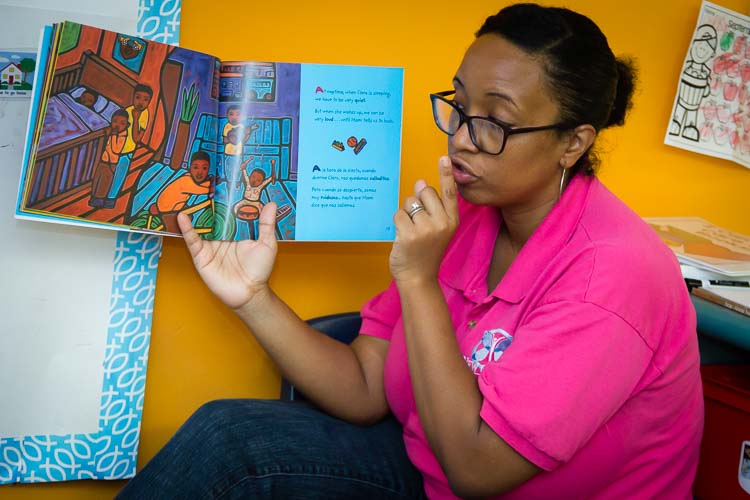 Mrs. Karmin Armstrong-Andrews, Preschool Teacher, reads a book to the class at New Genesis Photo by Susan Andress