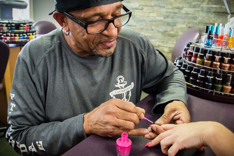 Ricky Thrash learned to do nails at his wife's suggestion. Photo by Susan Andress