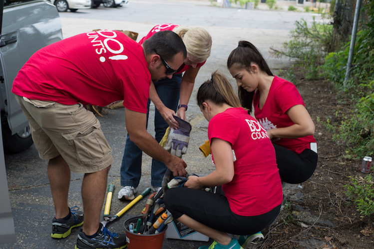 Workers from BDO help clean up the property after the Deja Vu has been removed. Photo by Fran Dwight.