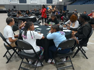 Attendees sample rice during the Village Network’s Rice and Flavor event at Kellogg Arena.