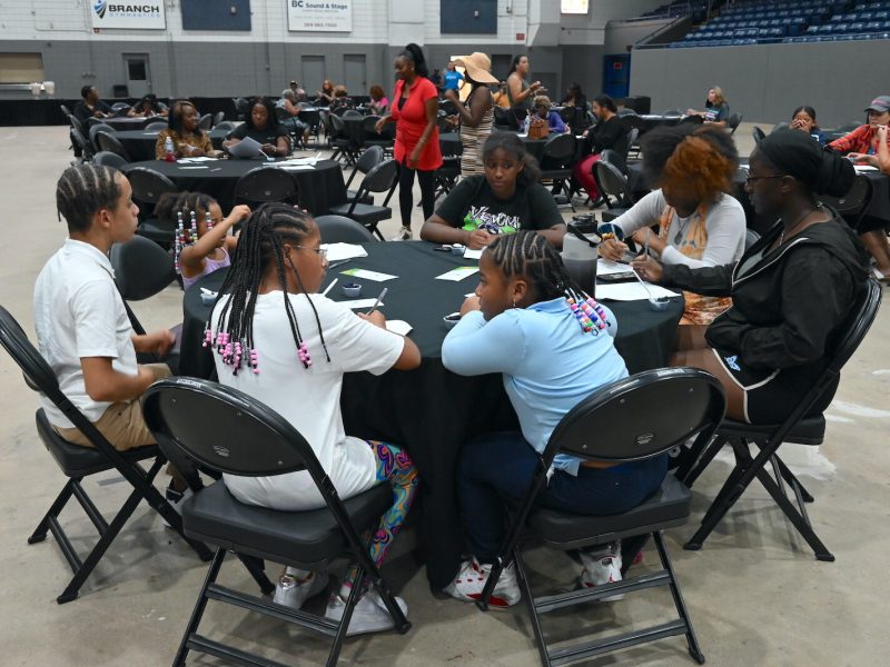 Attendees sample rice during the Village Network’s Rice and Flavor event at Kellogg Arena.