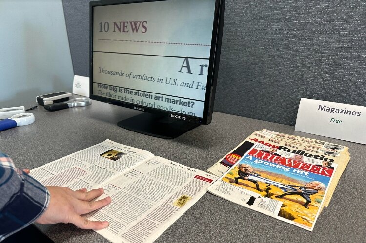 The library has a device that magnify images.