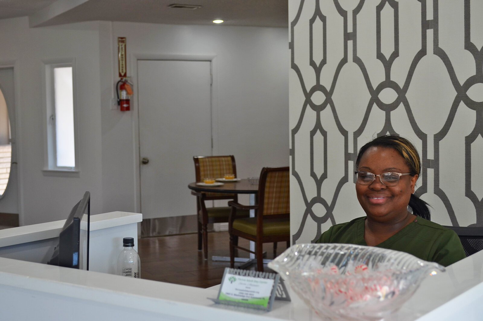 Thrive founder and owner Sarita Alexander sits smiling, ready to welcome new patrons.