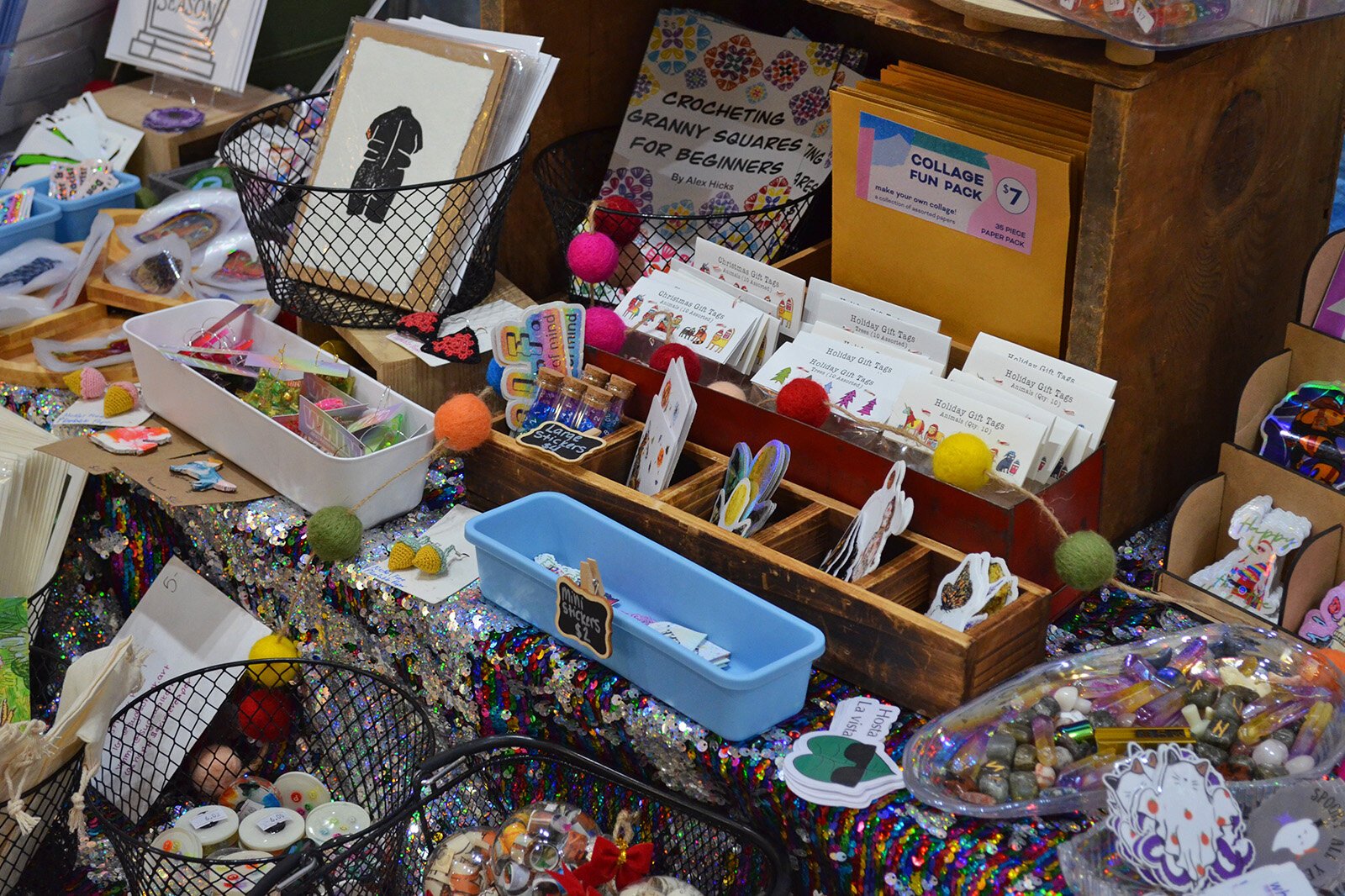 The tables inside Studio 209 were packed with glittering goods ready for bustling holiday shoppers. There were items of all different sizes and price points from prints, stickers, and buttons, to clothing, paintings, jewelry, and even furniture.