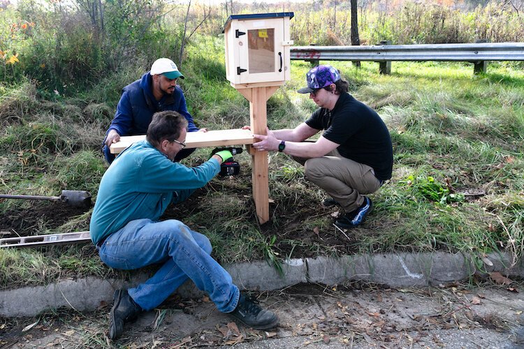 The Edison Resident Scholars installed Little Free Libraries to prepare for Literacy Trail.