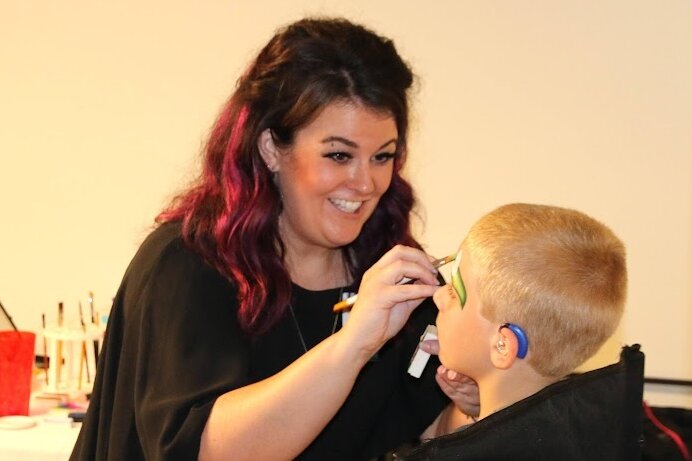 The event included resource tables, games, food and a chance for the local Deaf community to socialize and celebrate. (D&HHS)