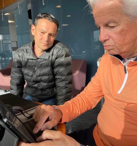 Charles “Charlie” Elwood and Chris Martin using version 2.0 of Martin’s voice for the first time at Carpe Latte Coffee Shop.