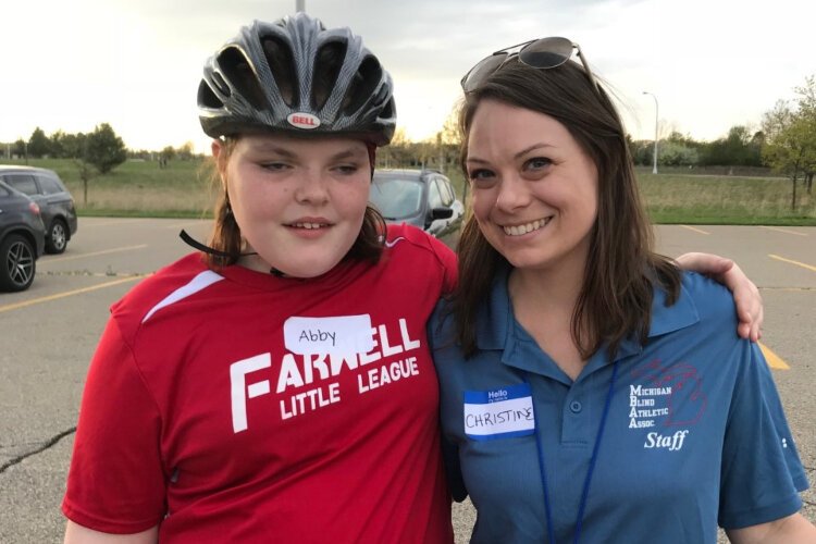 Christine Brauker, co-director of the Michigan Blind Athletic Association’s Sports Education Camp (right) poses with one of the camps' athletes Abby.