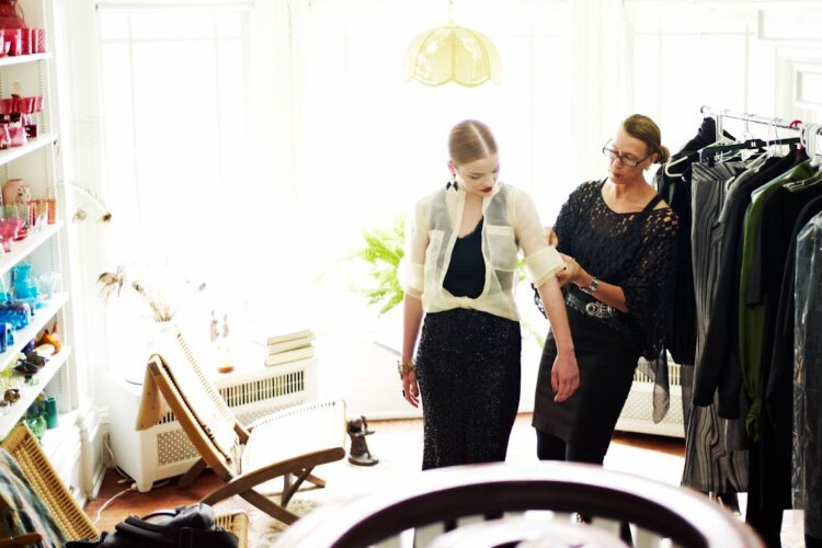 Mimi Ray puts the finishing touches on the wardrobe for a Magazine Shoot.