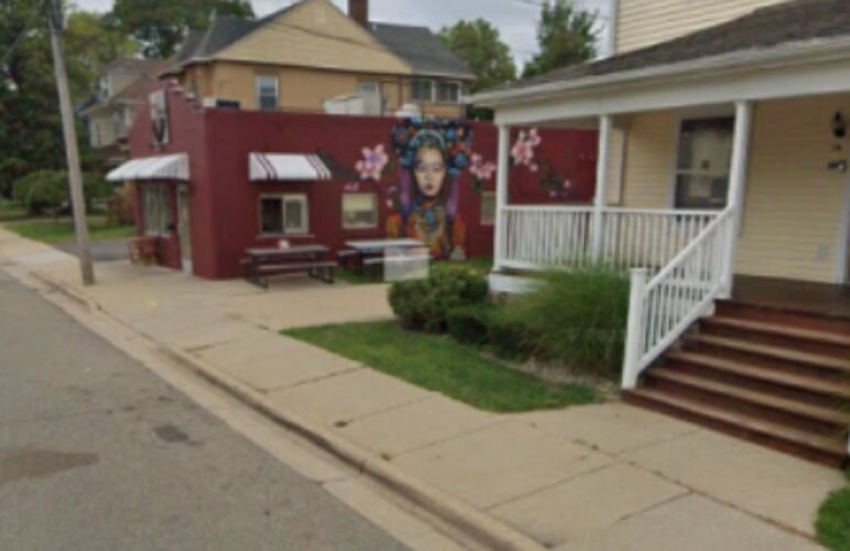 Picture of a colorful mural on the side of a building on Calhoun St., near downtown Battle Creek
