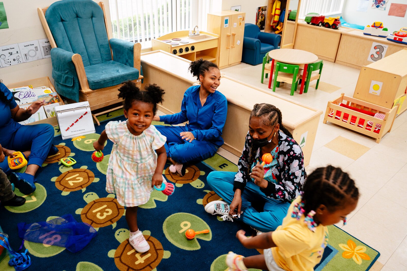Teachers Kiaundra Bronson and Dimika Hankins lead music and movement at New St. Paul Head Start Agency in Detroit.