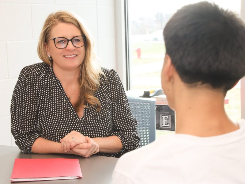 Kristin Graham, principal of Macatawa Bay Middle School, confers with a student.