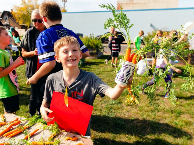 Students run a farm stand as part of Partridge Creek Farm's farm to school program in Ishpeming.