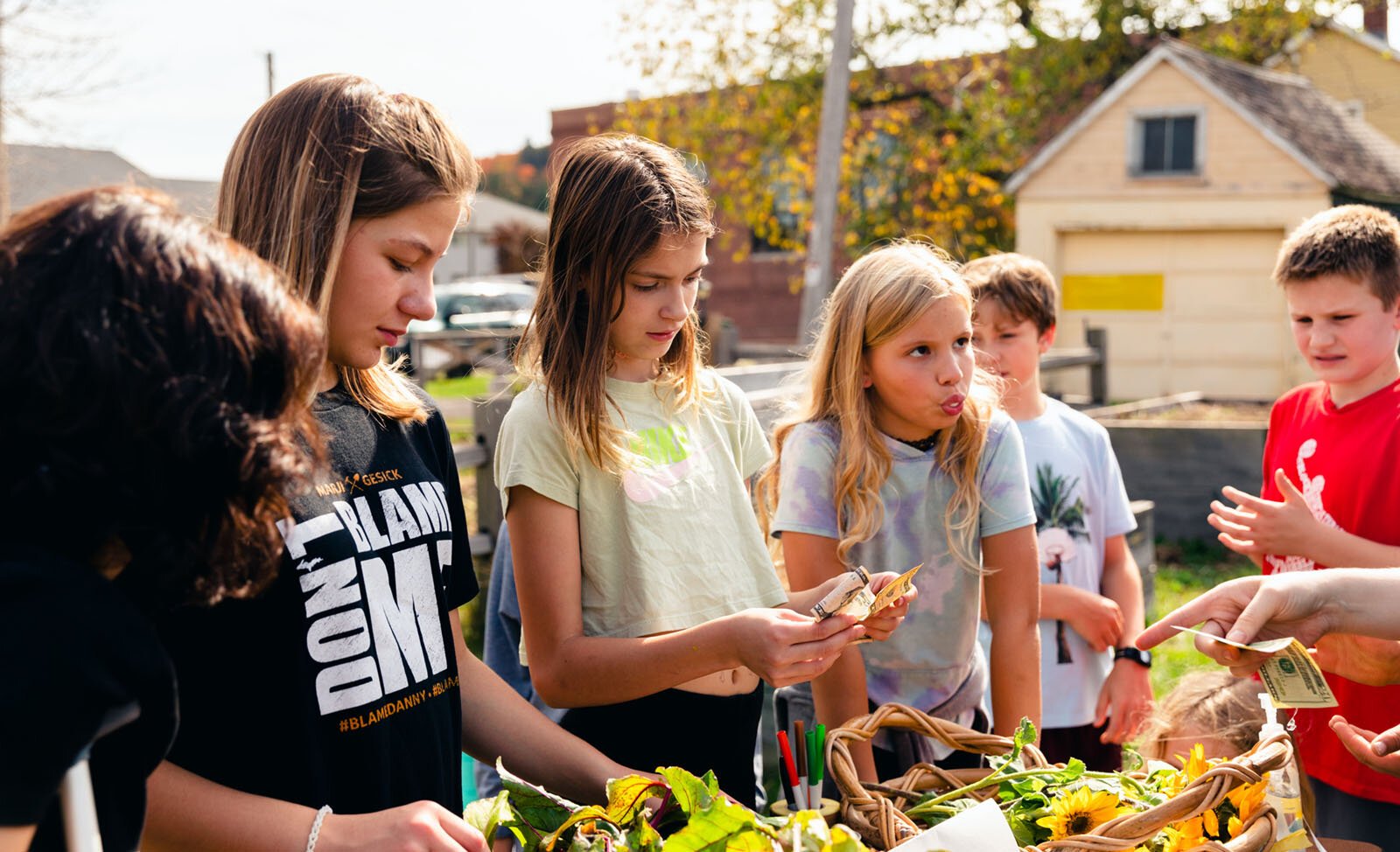 Students run a farm stand as part of Partridge Creek Farm's farm to school program in Ishpeming.