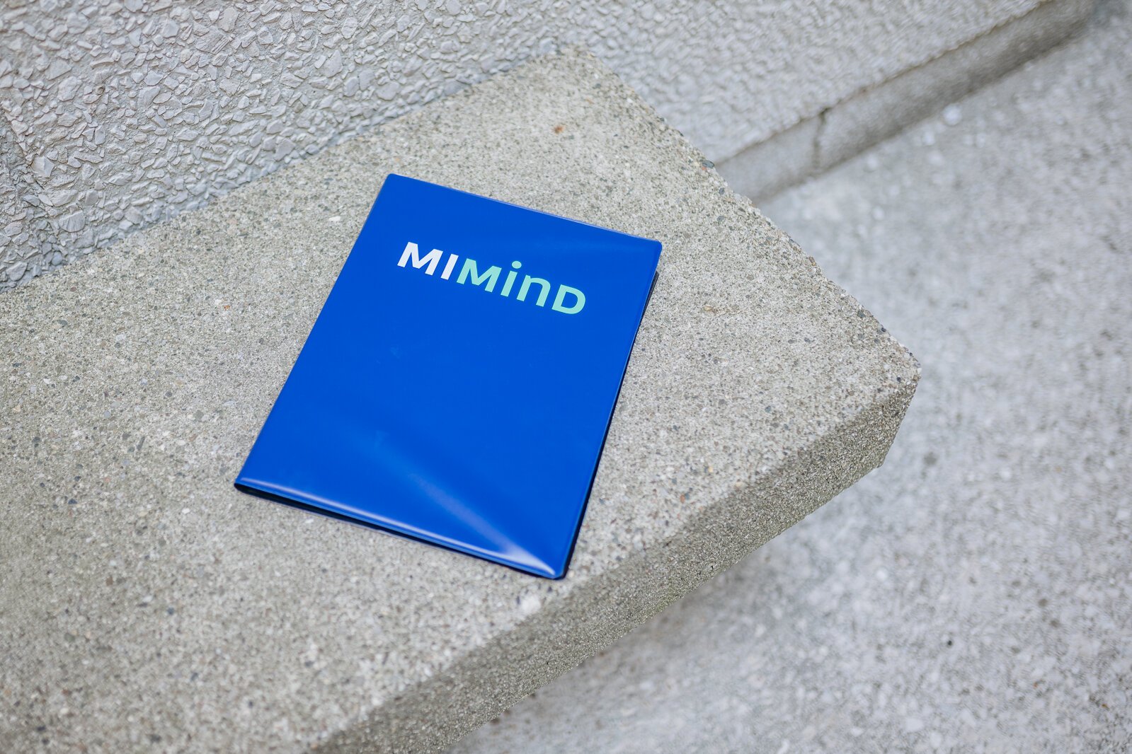 A folder of information about MI Mind.