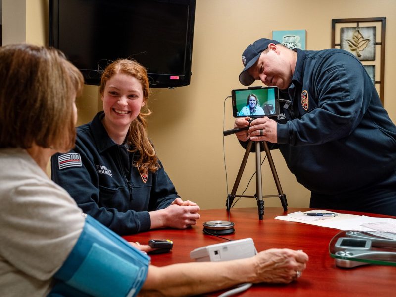 Community integrated paramedics Kim Whalen and Lt. Kevin Bailey of the Bloomfield Township Fire Department conduct a patient visit.