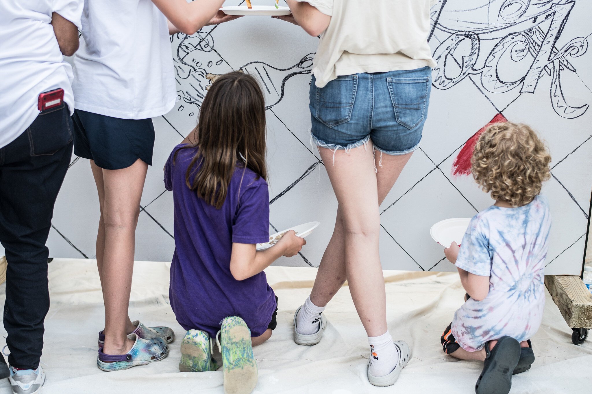 Attendees were invited to help paint the Brush the Block logo mural.