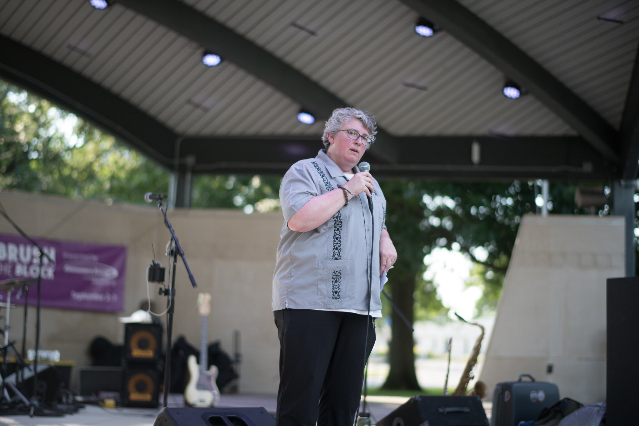 Kristen Chesak, Executive Director of the Arts Council of Greater Kalamazoo, speaks at the Brush the Block muralist announcement.