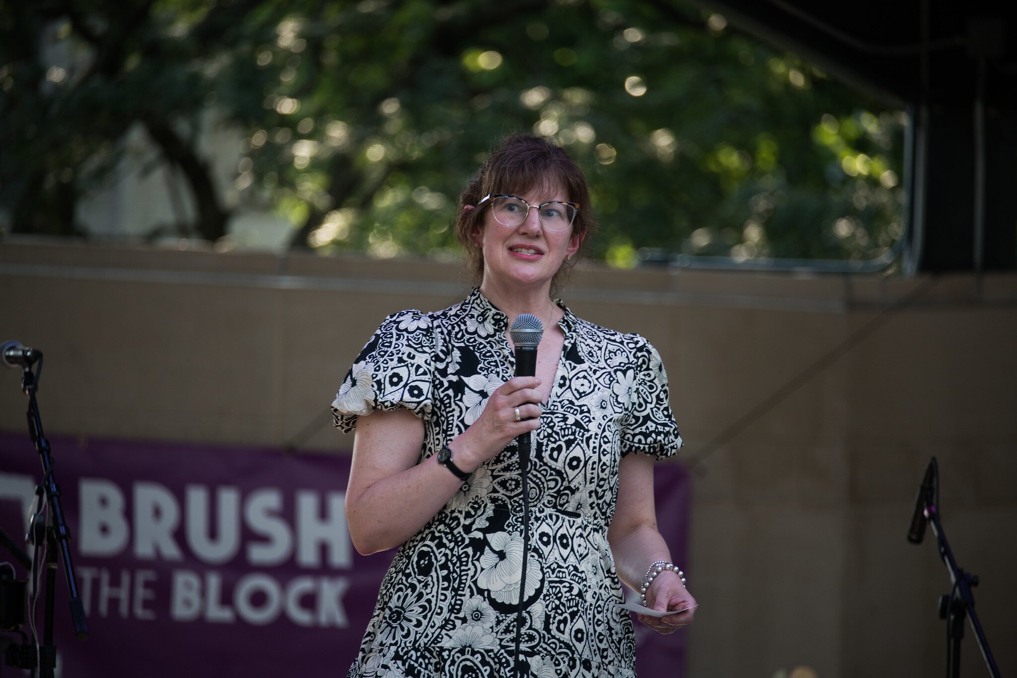 Rebekah Kik, Deputy City Manager, speaks at the Brush the Block muralist announcement.