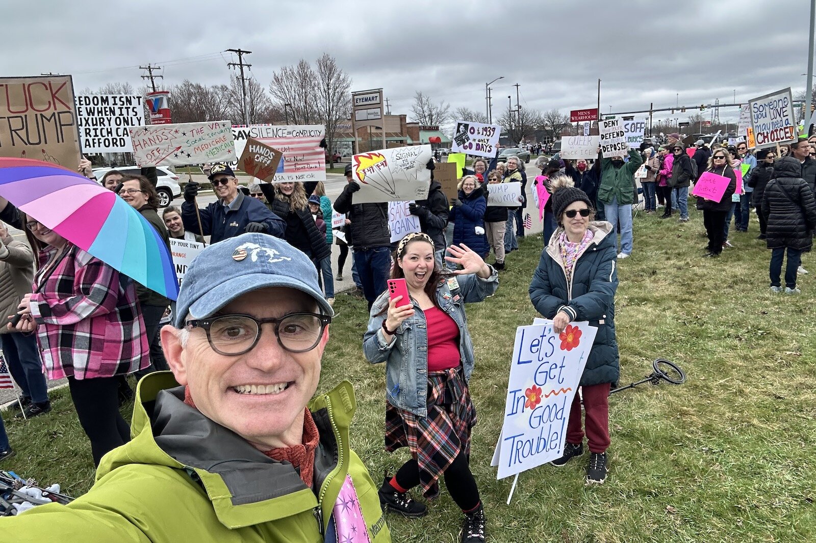 Ken Greschak (foreground) local organizer of the "Hands Off!" protest for Indivisible Kalamazoo.