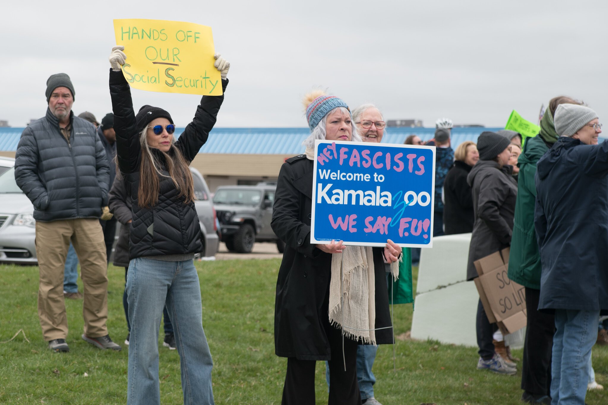 (Retired local media personality Lori Moore (blue hat), letting everyone know how she feels. Patti McNulty stands behind her with the yellow sign.