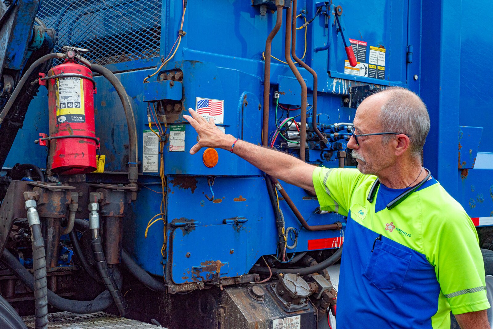 Dale Mentor, Republic Services recycling truck driver, gives a tour of his truck.